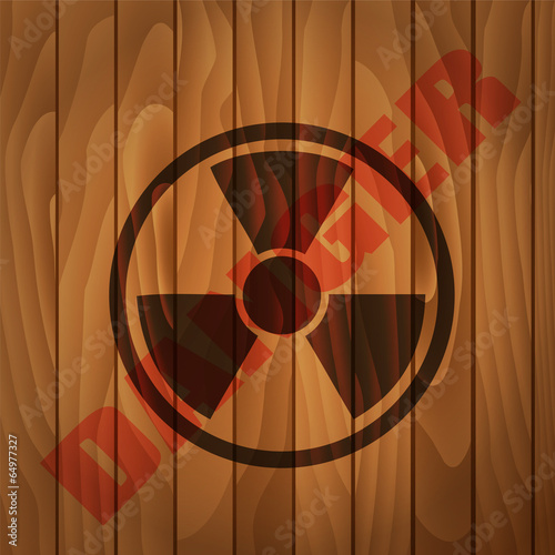 Stamp Danger label wooden background