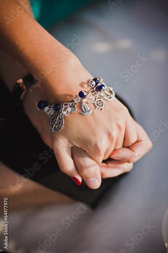 marine bracelet on a girl's hand holding a man's hand