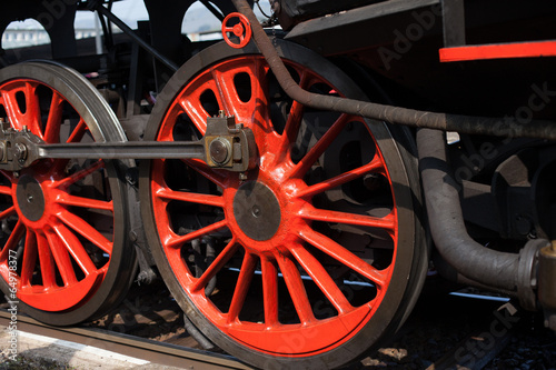 Red wheels of steam locomotive