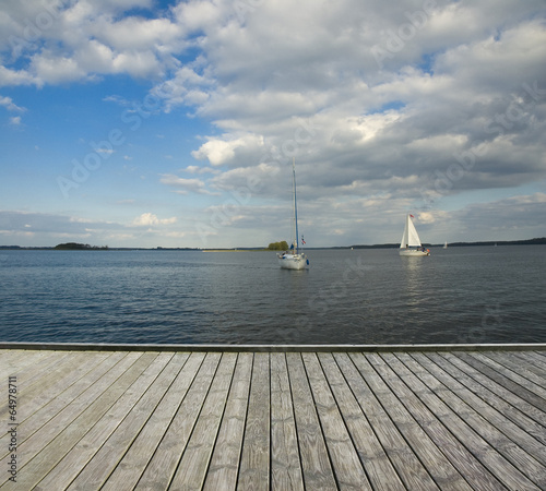 Wooden jetty and yachts