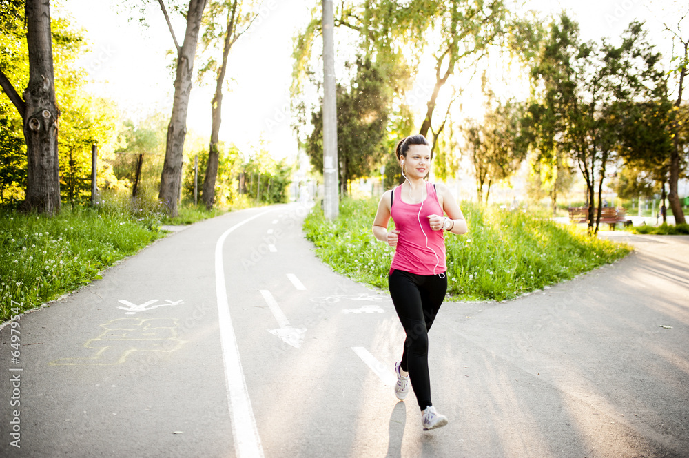 Portrait of a smiling active female runner. Fitness female Portrait of a smiling active female runner. Fitness female