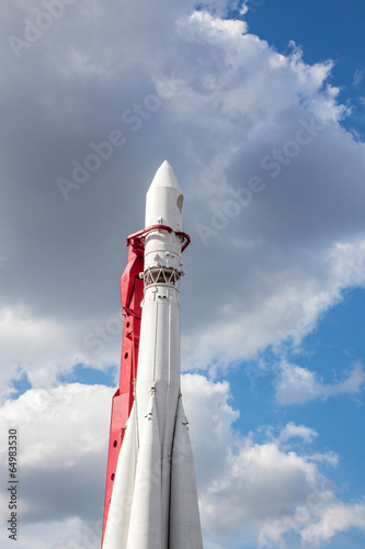 white rocket on blue sky background