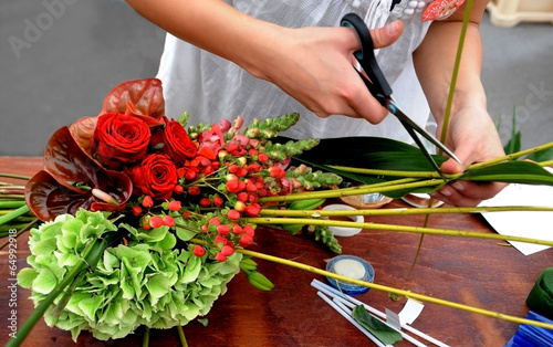 Florist makes flowers bouquet