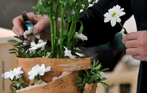 Florist makes flowers bouquet