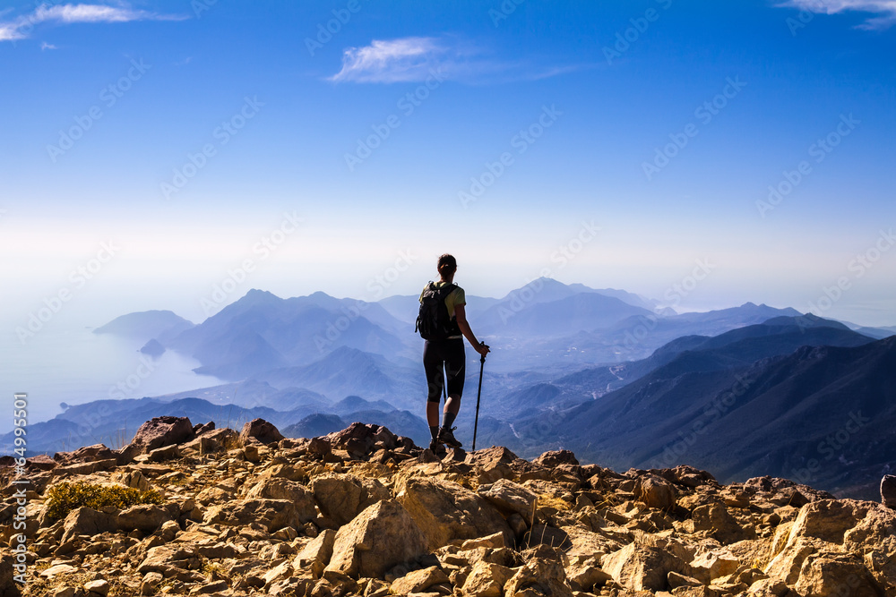 tourist woman on the top of mount,
