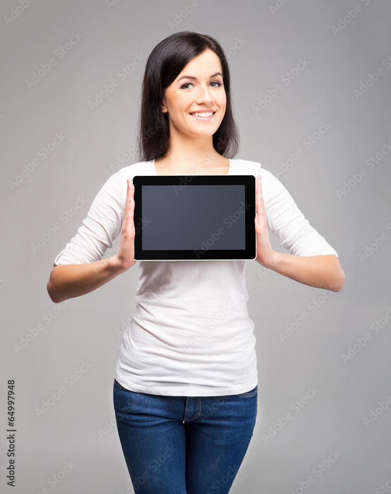 Young and beautiful teenager girl holding an ipad tablet pc Young and beautiful teenager girl holding an ipad tablet pc