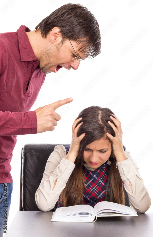 Portrait of angry menacing teacher threatening student Portrait of angry menacing teacher threatening student