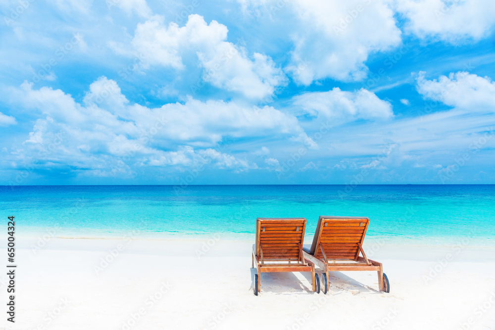 Two empty sunbed on the beach