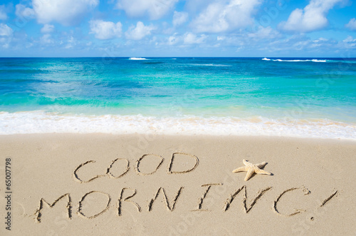 Sign "Good morning" on the beach
