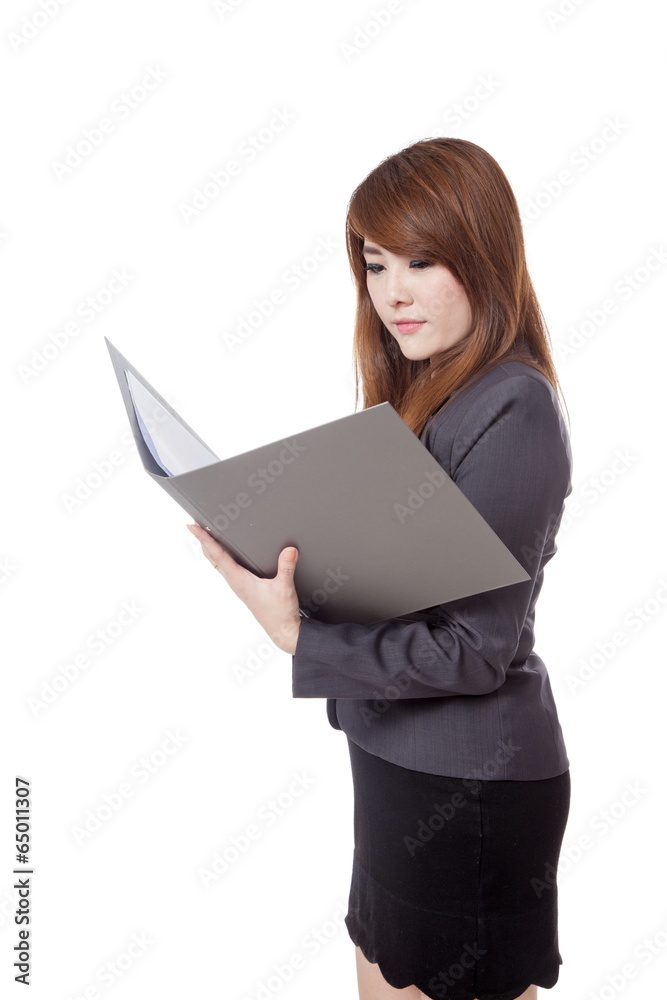 Asian businesswoman read data from report Asian businesswoman read data from report