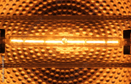 Halogen tube lamp with reflecting background photo