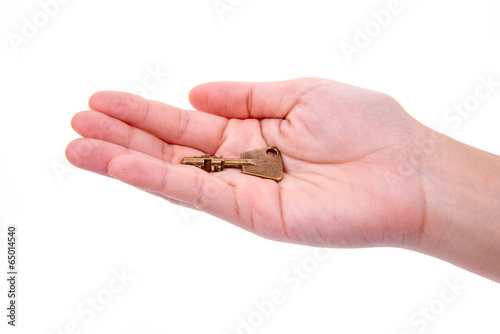 hand with old vintage metal keys isolated on white