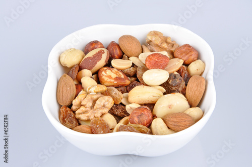 Mixed nuts in a white bowl