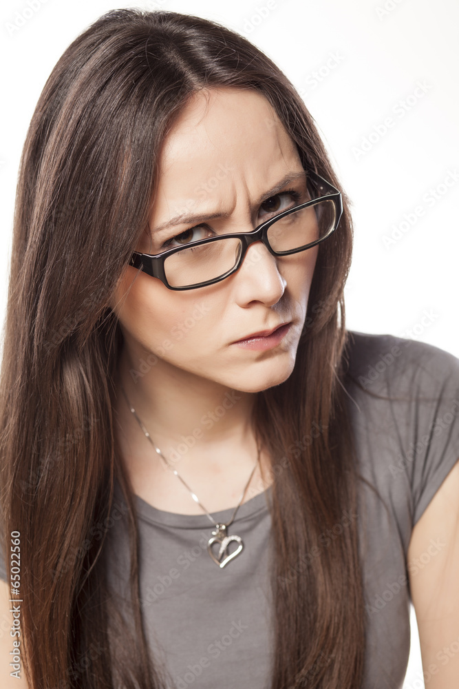frowning young woman with glasses