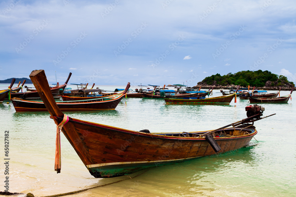 Long Tail Boats parking at the beach Long Tail Boats parking at the beach