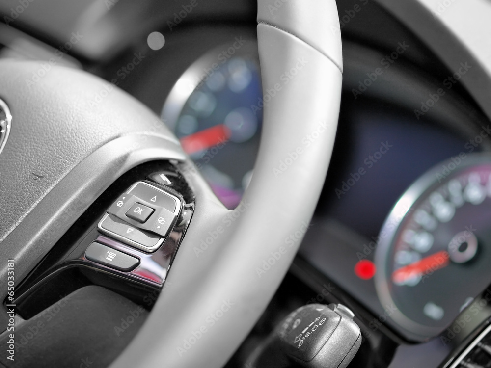Close up of steering wheel commands in modern luxurious car