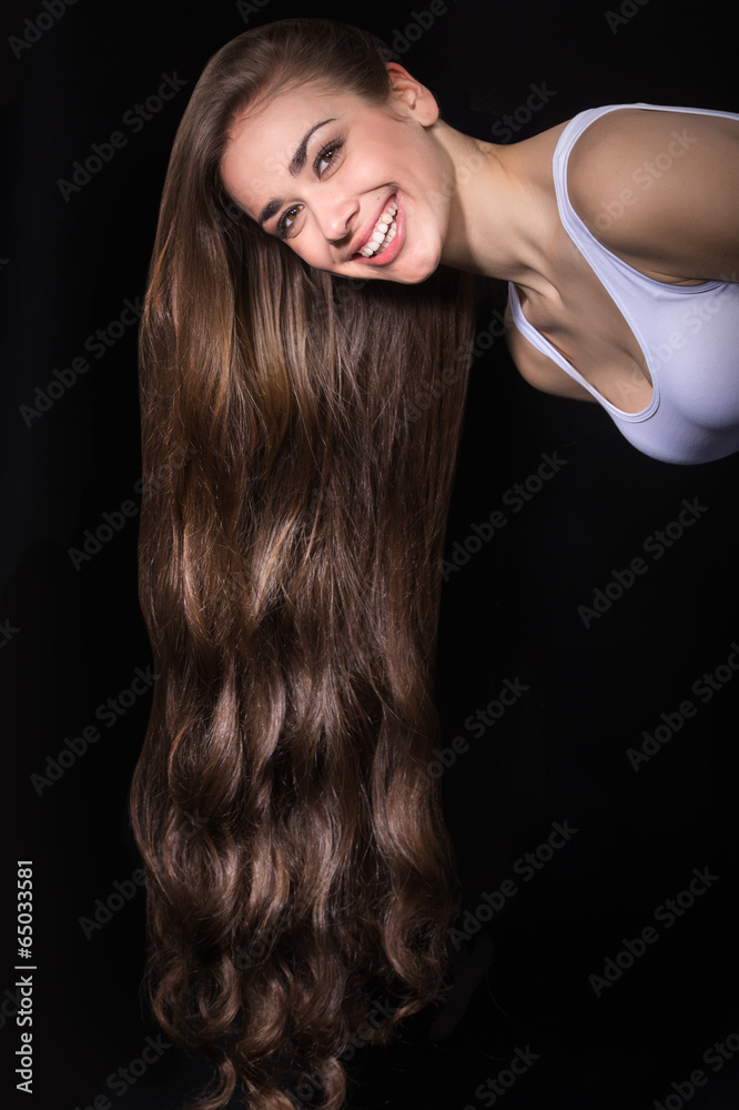 Photo of young woman with long hair. Photo of young woman with long hair.