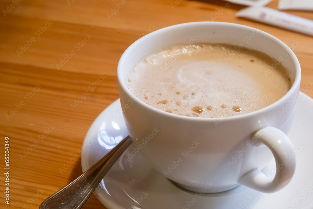 Cup of coffee on wooden table Cup of coffee on wooden table