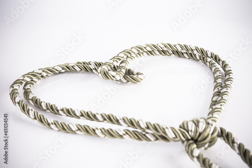 Rope valentine heart of simple design on white with copy space © TuTheLens