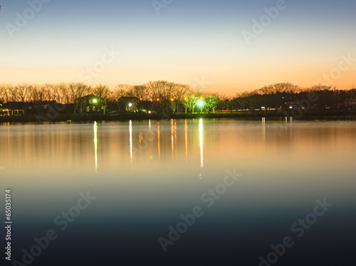 Reflection of sunset glow on the park pond, HDR