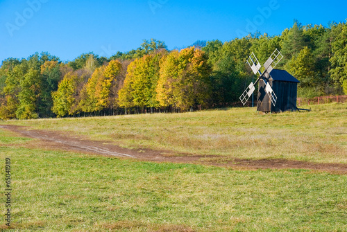 Vászonkép Antique ramshackle wooden windmill, Pirogovo, Kiev, Ukraine