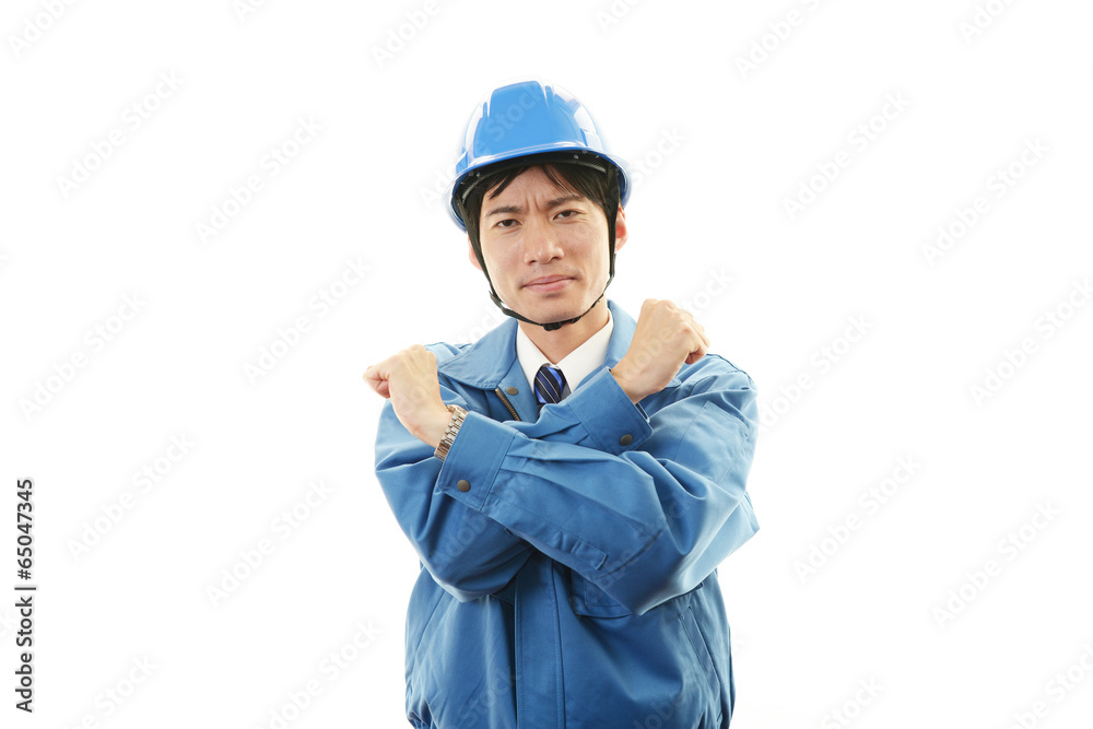 疲れた表情の作業員