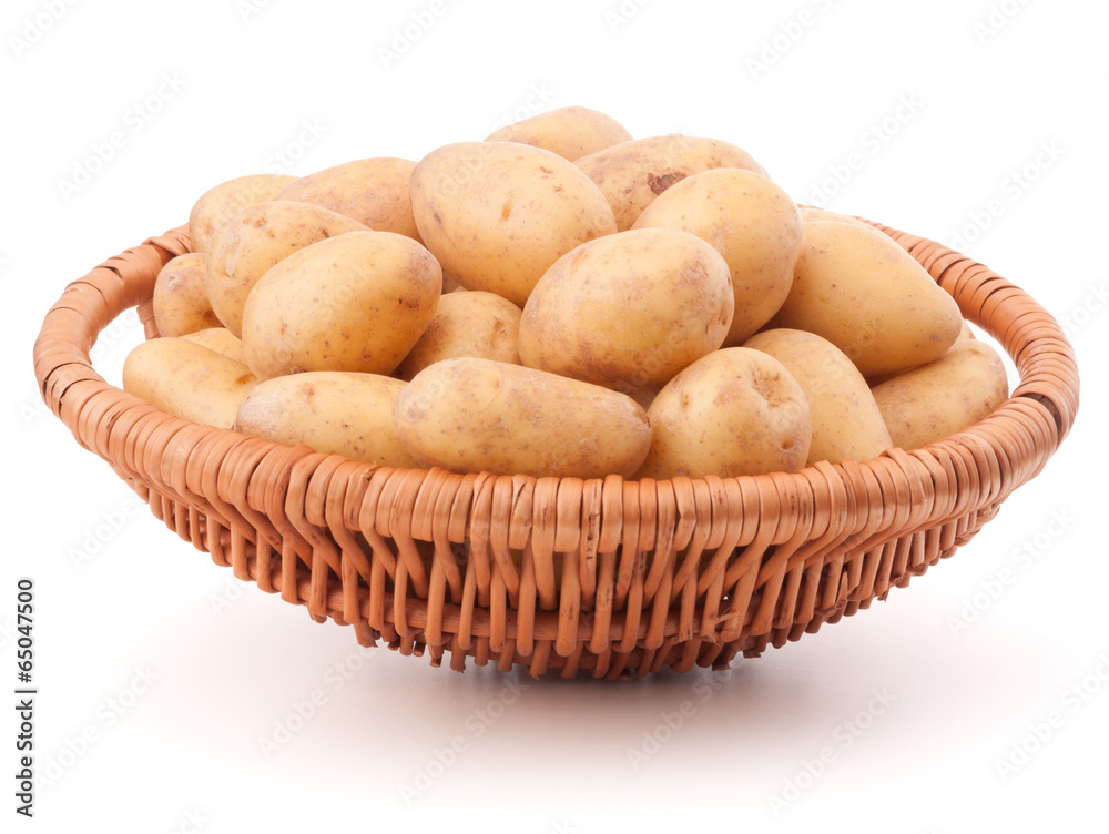 Potato tuber in wicker basket isolated on white background Potato tuber in wicker basket isolated on white background