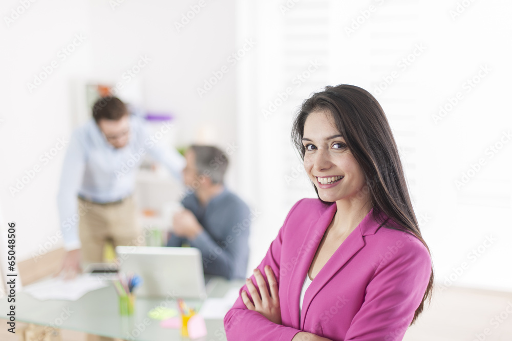 Portrait of a smiling businesswoman in meeting