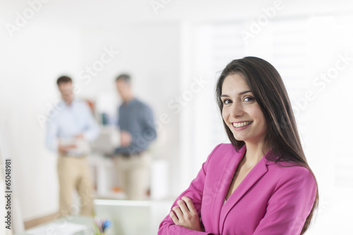 Portrait of a smiling businesswoman in meeting