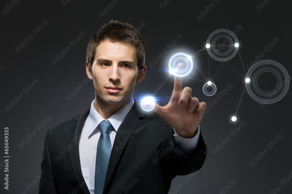 Businessman working with hightech touchscreen Businessman working with hightech touchscreen