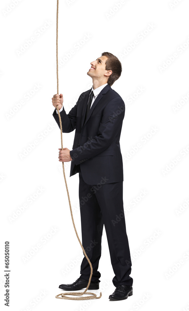 Full-length portrait of businessman swarming up the line Full-length portrait of businessman swarming up the line