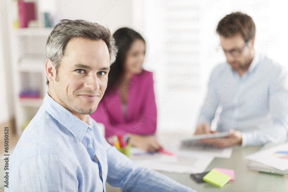 Portrait of a smiling senior businessman in meeting Portrait of a smiling senior businessman in meeting