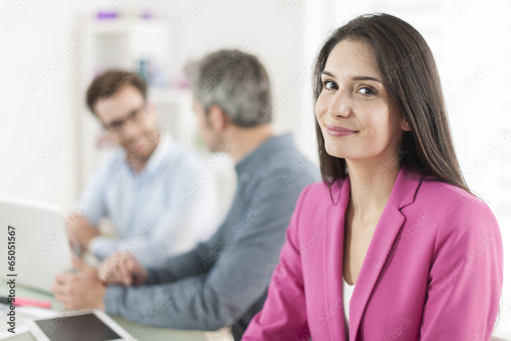 Portrait of a smiling businesswoman in meeting Portrait of a smiling businesswoman in meeting