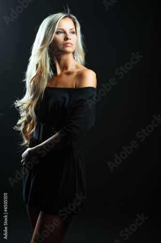 Young sensual model girl pose in studio
