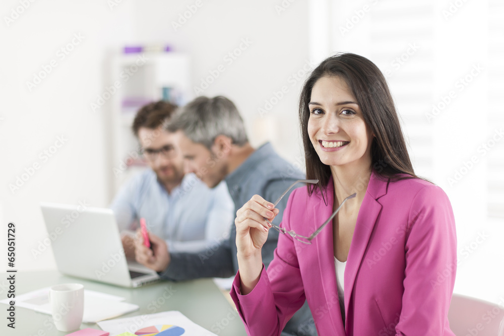 Portrait of a smiling businesswoman in meeting Portrait of a smiling businesswoman in meeting