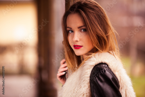 Gorgeous brunette standing on the train station portrait