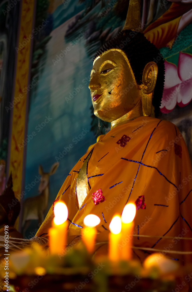 Buddha statue and candlelight