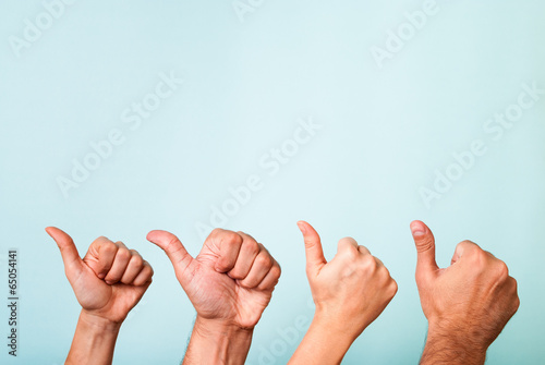 Success team with thumbs up