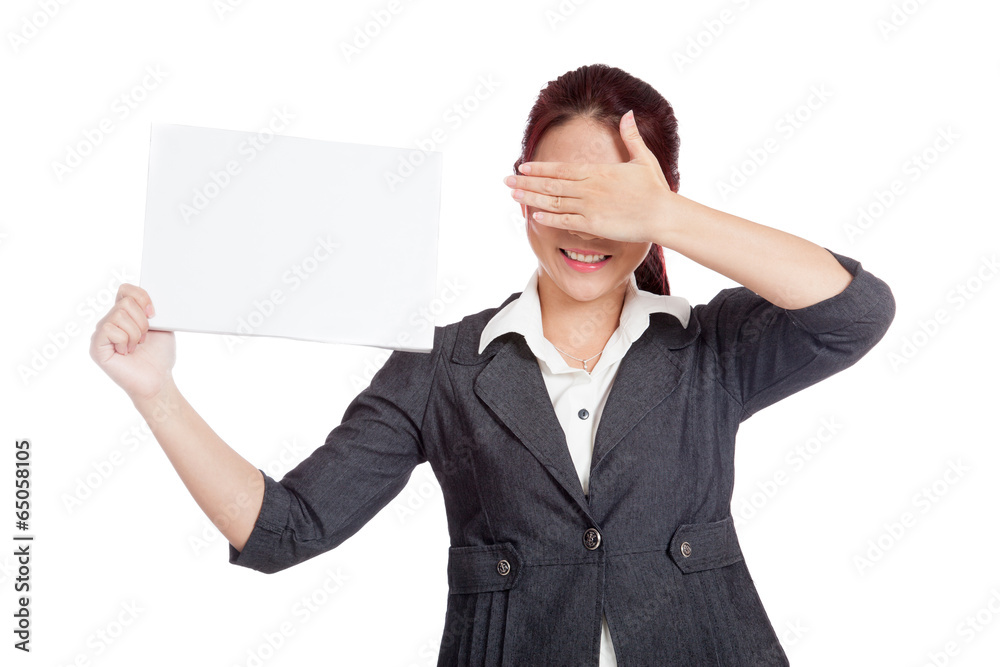Asian businesswoman hold a blank sign close her eyes with her ha Asian businesswoman hold a blank sign close her eyes with her ha
