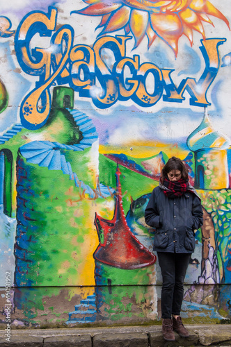 Hipster model standing next to a wall of graffiti in Glasgow © drimafilm