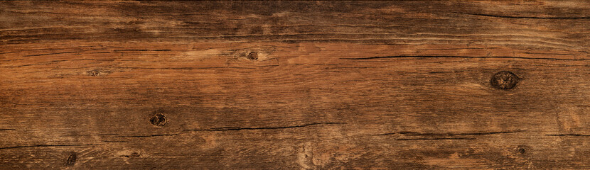 Wood texture background, weathered brown rough plank from rustic barn, long vintage board.