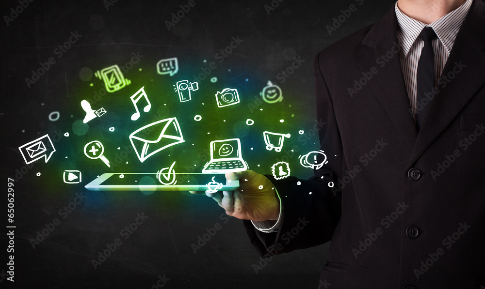 Obraz premium Person holding a tablet with media icons and symbols