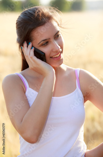 Young girl calling by phone