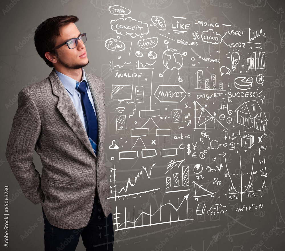 Attractive man looking at stock market graphs and symbols Attractive man looking at stock market graphs and symbols