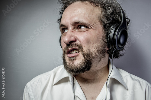 hate music, man with intense expression, white shirt