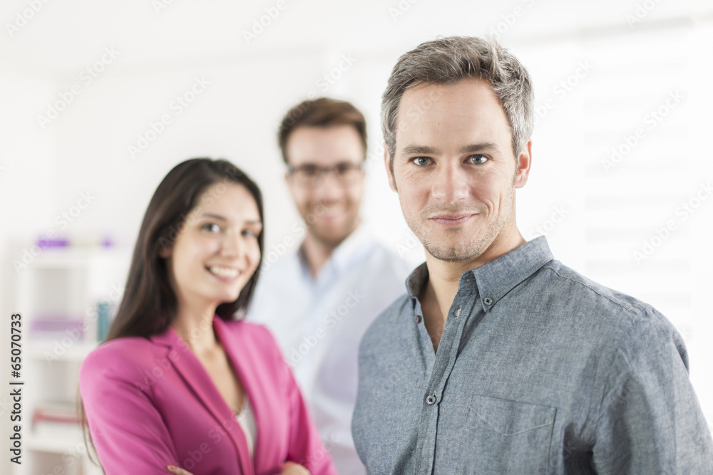 Portrait of a smiling senior businessman in the foreground Portrait of a smiling senior businessman in the foreground
