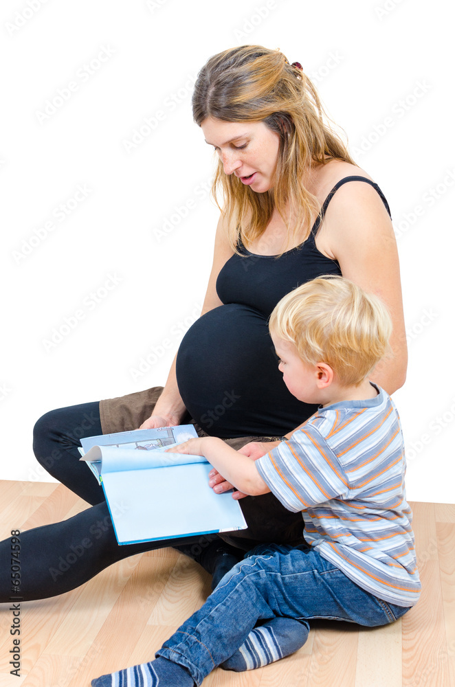 Beautiful pregnant happy mother with child boy reading book isol Beautiful pregnant happy mother with child boy reading book isol
