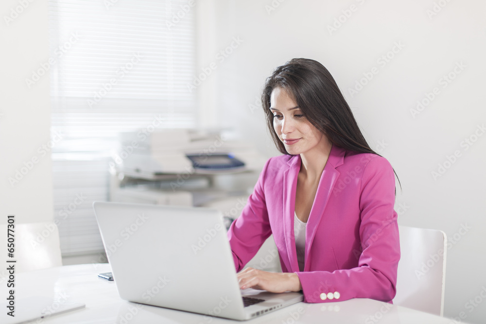 beautiful businesswoman at office in front her laptop beautiful businesswoman at office in front her laptop