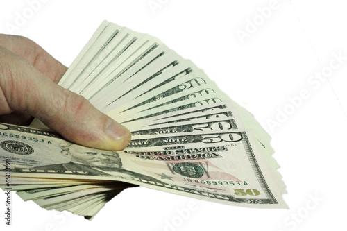 Mans hand holding a stacks of paper dollars USA on the white bac