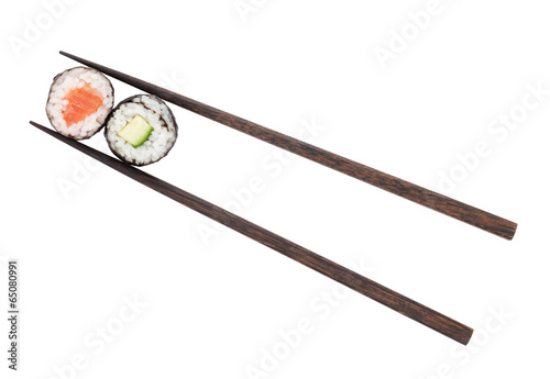 Sushi maki with salmon and cucumber in chopsticks